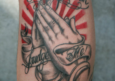 Tattoo praying hands with lettering: only god can judge me