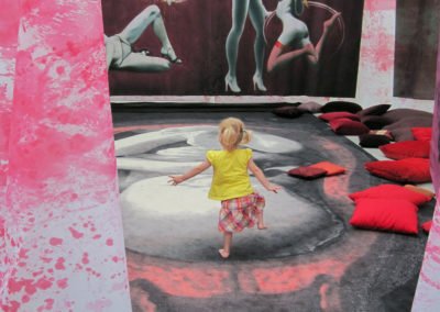 A little girl inside a large scale art-installation by artist Jasmina Kirsch, titled 'the paradox of female sexuality'