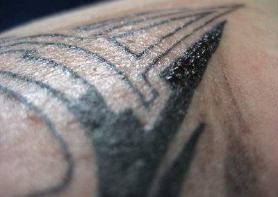 Photograph closeup of freshly tattooed skin.